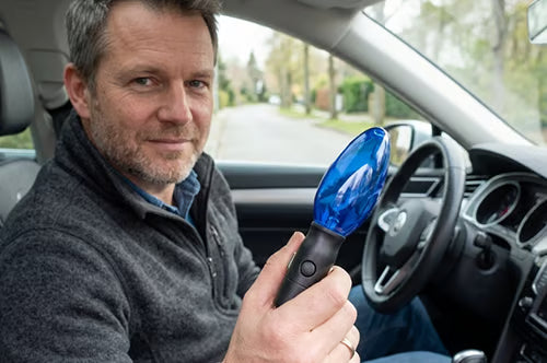 Customer holding the device in their car